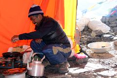 29 Climbing Sherpa Lal Singh Tamang Preparing Breakfast In The Kitchen Tent At Mount Everest North Face Advanced Base Camp 6400m In Tibet.jpg